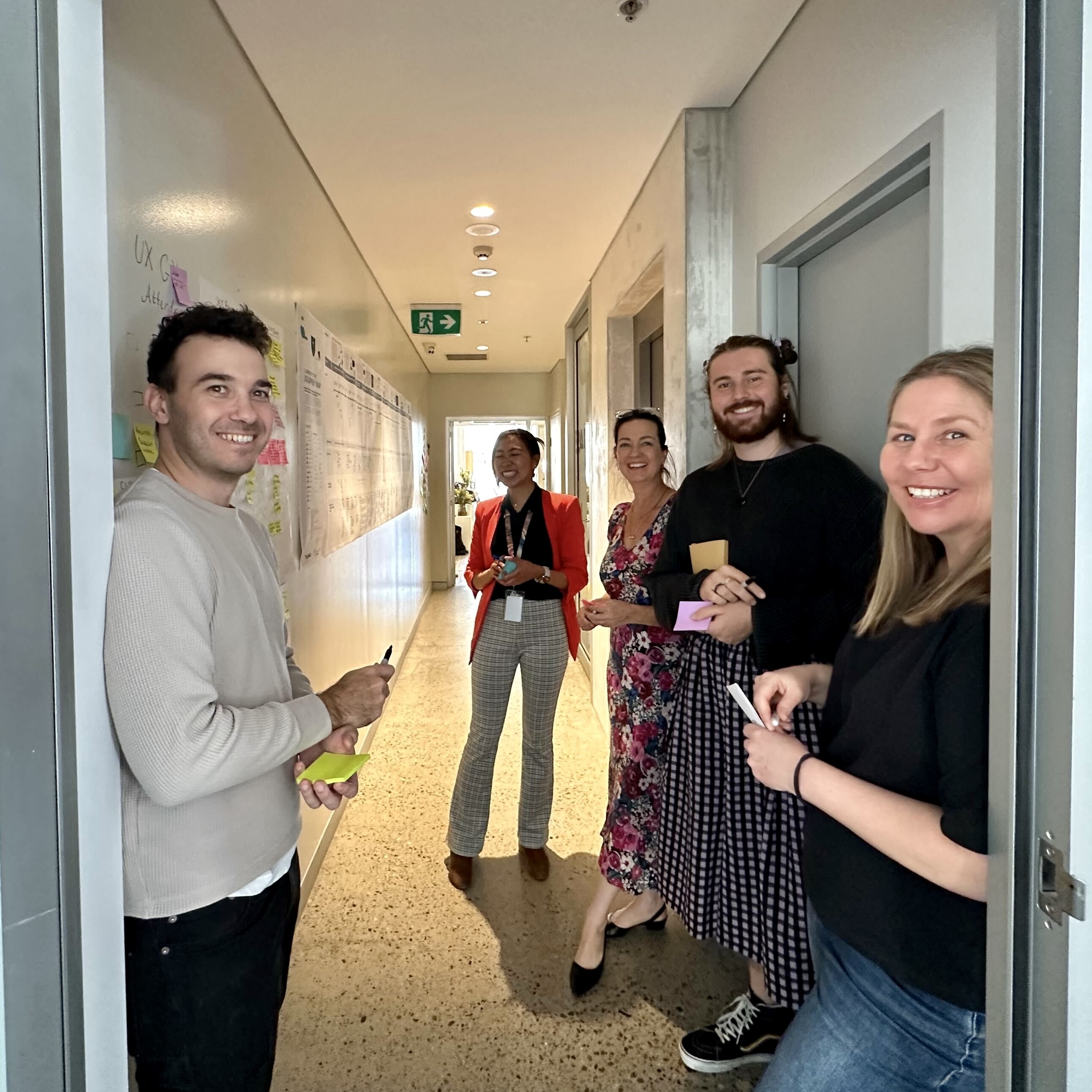 Victor smilling with coworkers for a workshop.